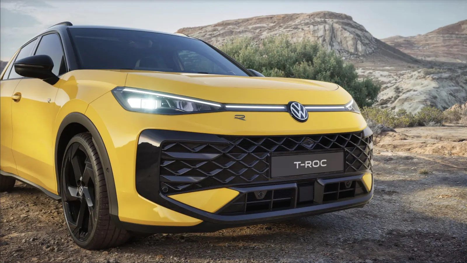 Yellow SUV in a desert landscape